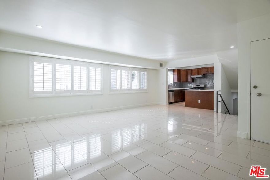 Designer-Remodeled Townhome style Apt in Prime Beverly Hills!Stunning, fully renovated townhome-style apartment in the heart of Beverly Hills. This spacious unit offers approximately 1,400sq ft, 2 BD, 2 BA, 1 parking. Updated kitchen with quartz countertops and stainless steel appliances. Spacious, open living room, master bedroom with en-suite bathroom, double sinks, Bathtub, walk in closet and second bedroom (downstairs) with its own bathroom & standing shower. Central Heating & AC, Tile floor throughout, modern wood shutter window coverings, and LED lighting throughout. New shower head, spout & handle. In- unit LG washer & dryer included. Located in a fantastic Beverly Hills location close to shops, restaurants, and just 10 minutes from Rodeo Drive. Part of the renowned Beverly Hills Unified School District