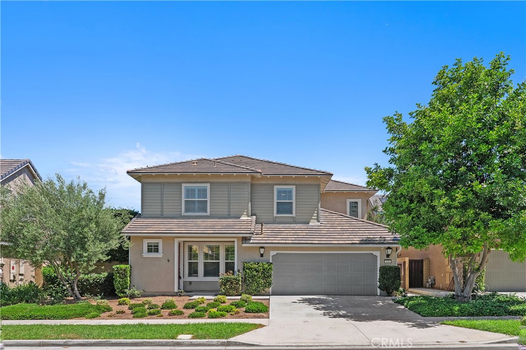 Ready to move-in, this 3 bedroom, 2.5 bathroom home with a 2-car garage sits in Irvine’s Pavilion Park, part of the highly sought-after Great Park community. The first floor features Italian porcelain tile flooring and an open-concept layout with a kitchen offering quartz countertops, two walk-in pantries, extended cabinetry, and top-of-the-line appliances including a Samsung dual zone French door refrigerator and brand-new LG washer/dryer. Adjacent to the kitchen is a dedicated laundry room with storage, sink, and a versatile workspace. The living room is highlighted by a custom entertainment unit with fireplace, 70-inch smart TV, and Sonos sound bar, while a 12’ x 9’ accordion glass door opens to a private, L-shaped landscaped backyard with mature fruit trees, pavers, and landscape lighting for an intimate indoor-outdoor entertaining experience. Upstairs you’ll find bamboo flooring throughout, three bedrooms each with cable/data lines, and a primary suite with oversized shower, double vanities, and a custom walk-in closet. One bedroom features a built-in queen Murphy bed with cabinetry, ideal for maximizing space or creating a home office. Additional upgrades include plantation shutters, custom 9’ doors, extensive cabinetry, garage storage with overhead racks, solar panels, and a whole-house water filtration system. Rent includes gardening service, trash, and HOA dues. Community amenities include a clubhouse, BBQ areas, playground, pool, spa, fire pit, and green space, plus full access to Beacon Park amenities and The Pools with cabanas, firepits, and additional play areas.