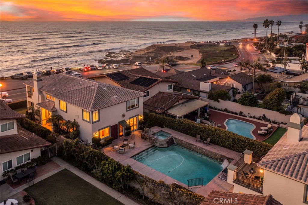 Situated on the world renowned So Cal’s Sunset Cliffs coastline, this Mediterranean masterpiece offers a rare opportunity to call this slice of coastline yours. Situated on almost a full quarter acre of land consisting of a main house with 4,237 square feet of living space on the front side of the parcel overlooking the coastline, a separate 890 square foot casita over the 3 car garage on the back side of the parcel and a massive 20,000 gallon pool and jacuzzi. The grand 2 story entry to the main home really sets the stage allowing direct views out to the ocean and leading seamlessly into your main living space or second story. 24 x 24 travertine tile laces your entire lower level, solid core interior doors throughout, the formal living room kitchen and breakfast nook are located on the front side of the property, allowing for direct expensive views of the coastline and ocean, along with tons of natural light pouring through the windows. Imagine prepping meals in your new kitchen overlooking the ocean, it doesn’t get any better! The kitchen offers, ample storage, KitchenAid fridge, and freezer combo, warming tray and solid slab bullnose counters. The formal family and dining room is centrally located on the lower level, offering more than enough space for entertaining. Rounding out the first story is your laundry room spare bedroom with direct access to backyard and a full bath ready for you to enjoy! Upstairs offers a second formal living space and patio all allowing for the best views of the SoCal coastline, a bar area with dining nook, half bath, two oversize, spare bedrooms, both with brand new carpet, another full bath with walk-in shower and soaking tub and of course your primary suite With new carpet, ample in size, his and her sinks in the bathroom, walk-in shower plus soaking tub and large walk-in closet. It doesn’t stop here, the casita offers panoramic views off the teak deck, two bedrooms well situated in the size, a full bathroom and an open living space feeding off the recently renovated kitchen and breakfast nook. For garage lovers the tall doors offer plenty of space for your lifted vehicles to pull right in! Your pool and jacuzzi are the focal point of the outdoor space surrounded by water features and mature, lush landscaping around every corner! Experience So Cal coastal living at its finest! SELLER HAPPY TO PROVIDE A RATE BUYDOWN OR CLOSING COST CREDIT FOR BUYER AND IS OPEN TO OWNER FINANCING.