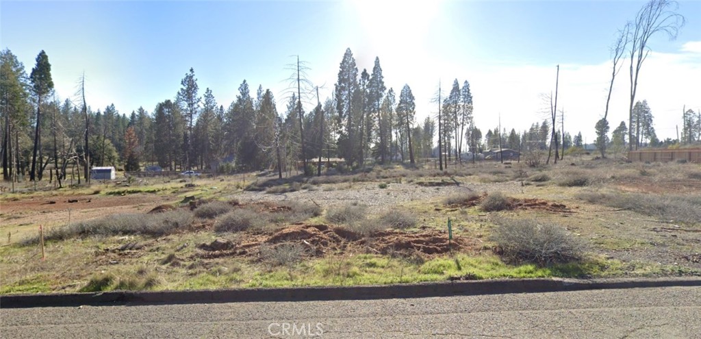 Excellent lot located in a Cul-De-Sac just minutes from shopping, dining, with easy access to Paradise, Chico, and Oroville. As part of the Paradise Pines Property Owners Association, you'll enjoy fantastic amenities for only $26/month. Perks include a clubhouse with meeting rooms, two event centers featuring full kitchens, a bar and lounge, tennis and bocce ball courts, a playground, scenic hiking trails, and a relaxing pool and spa. An ideal setting for those seeking both quiet living and vibrant community features!