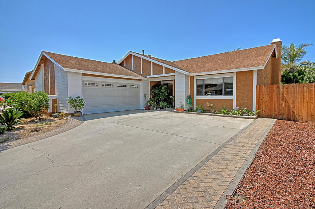 Single story with upgrades throughout! Kitchen has newer cabinets, granite & stainless appliances, tile flooring. Living/Dining room has vaulted ceilings. Fireplace, wood-like flooring, newly painted interior. All new interior doors . Master has vaulted ceilings, newer slider to rear yard, remodeled bath with glass shower enclosure. Bedrooms have mirrored closet doors. Laundry room with cabinetry, attic access and shelves for storage, direct access to garage. 2 car garage with roll-up door. Backyard has dog run. A MUST SEE!
