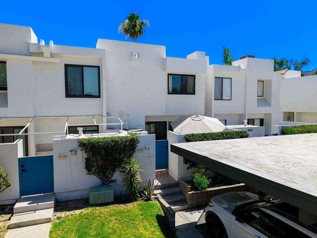 Step into this beautifully updated 2-bedroom, 1.5-bath townhome nestled in the desirable Mountainback communitya'just minutes from El Paseo, The Living Desert, and Civic Center Park. Thoughtfully renovated throughout, this home blends modern finishes with laid-back desert charm.The light-filled main level welcomes you with polished concrete floors, an open-concept layout, and a chic powder room. The kitchen boasts stainless steel appliances, quartz countertops, and a custom tile backsplash, flowing into the dining and living spacesa'perfect for entertaining or relaxing at home.Enjoy the best of indoor-outdoor living with a north-facing enclosed front courtyard ideal for morning coffee, and a south-facing back patio bathed in sun. A large under-stair storage closet adds functionality.Upstairs, two spacious bedrooms share an updated full bath featuring quartz counters, a custom-tiled shower/tub combo, and matching tile floors. The upstairs laundry nook adds convenience right where you need it.With two assigned parking spaces, resort-style amenities including pools, spa, and tennis courts, and low HOA dues, this townhome is perfect for full-time living, a seasonal retreat, or a smart investment.Modern comfort, designer finishes, and an unbeatable locationa'this is desert living at its best.