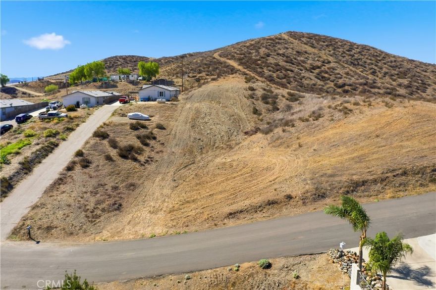 LARGE VIEW LOT, 15,682 SQ. FT. located in the very desirable Rural Family area of the fast growing City of Menifee. LOW PROPERTY TAXES & NO HOA!!!!! This land will accommodate either a frame-built house or a manufactured home. Conveniently located near the 215 and 15 Freeways, Menifee Market Place,  Schools, Hospitals and Church. Potential Buyers to do their own investigation during their due diligence time-frame stated in the Purchase Contract as to the requirements from the City to develop property.