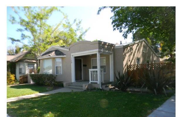 Welcome to this charming 2-bedroom, 1-bathroom home located in the heart of Hollister. With a lot size of 7000 square feet, this property offers ample space for outdoor activities. Inside, the home features a well-appointed kitchen with granite countertops, perfect for cooking and entertaining. The dining area is conveniently situated in the eat-in kitchen, enhancing the home's cozy atmosphere. The flooring throughout the home includes a mix of hardwood, laminate, and tile, adding both style and durability. Warm up during cooler months with the fireplace, creating a comforting ambiance in the living area. For your convenience, laundry is located in the utility room, making household tasks more manageable. Additional amenities include a forced air heating system and a spacious 2-car garage & possible RV parking too. Don't miss this opportunity to own a beautiful home in Hollister.