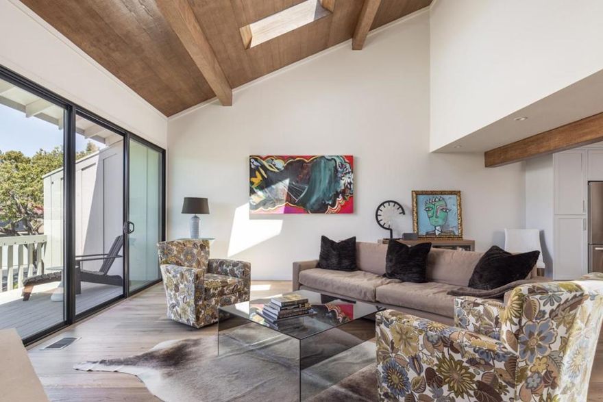 Welcome to this beautifully renovated, light-filled contemporary townhouse, tucked away in a quiet, gated community and backing onto a serene greenbelt. Here, you'll enjoy the perfect blend of modern comfort and natural surroundings, offering a peaceful, low-maintenance lifestyle.  Step inside to a freshly updated interior, complete with a brand-new kitchen and baths with an open-concept layout. The home features 3 spacious beds and 3.5 baths, including a main-floor primary suite; a second primary-style suite and third guest suite are upstairs.   Natural light pours into the warm and welcoming living room through skylights and large windows, offering views of the surrounding greenery, while the fireplace anchors an intimate gathering space.  The open layout flows effortlessly into the kitchen and dedicated dining area, while multiple decks invite seamless indoor-outdoor living and exquisite cross breezes.    The community features a shared pool and spa, and the townhouse is located within walking distance of Carmel Valley Ranch amenities - the championship golf course, River Ranch fitness center and pools, and the beloved Valley Kitchen restaurant.    A perfect combination of style, flexibility, and tranquility, this home offers a lifestyle of ease, elegance, and community.