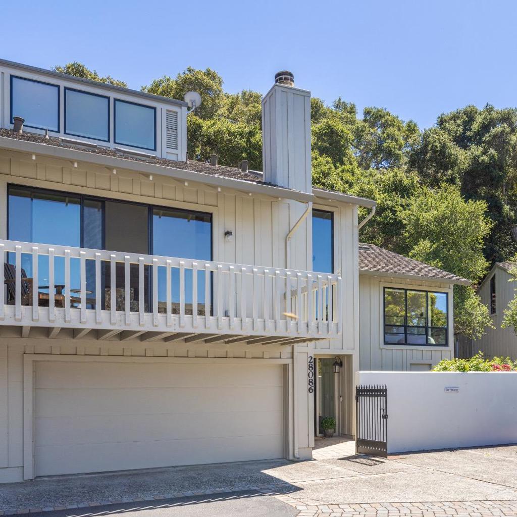 Welcome to this beautifully renovated, light-filled contemporary townhouse, tucked away in a quiet, gated community and backing onto a serene greenbelt. Here, you'll enjoy the perfect blend of modern comfort and natural surroundings, offering a peaceful, low-maintenance lifestyle. Step inside to a freshly updated interior, complete with a brand-new kitchen and baths with an open-concept layout. The home features 3 spacious beds and 3.5 baths, including a main-floor primary suite; a second primary-style suite and third guest suite are upstairs. Natural light pours into the warm and welcoming living room through skylights and large windows, offering views of the surrounding greenery, while the fireplace anchors an intimate gathering space. The open layout flows effortlessly into the kitchen and dedicated dining area, while multiple decks invite seamless indoor-outdoor living and exquisite cross breezes. The community features a shared pool and spa, and the townhouse is located within walking distance of Carmel Valley Ranch amenities - the championship golf course, River Ranch fitness center and pools, and the beloved Valley Kitchen restaurant. A perfect combination of style, flexibility, and tranquility, this home offers a lifestyle of ease, elegance, and community.