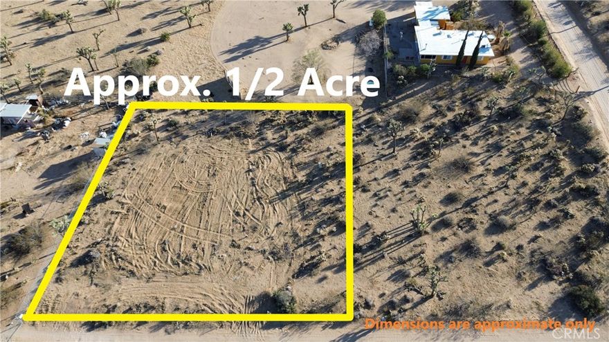 Large 1/2 acre view lot located in South Joshua Tree with high end custom homes in the neighborhood. Close to Joshua Tree National Park and downtown Joshua Tree Village shops, dining and entertainment. Great desert setting with different cactus types and several Joshua Trees on the outskirts of the property plus a large open area for building your dream home in the center of this large lot. The land is slightly elevated to allow for dramatic mountain views and city lights views of Joshua Tree Village at night. Located almost directly across from the popular new Rivian Adventure Network charging station on 29 Palms Hwy. Utilities (water,electric,natural gas,internet,phone,cable) all conveniently located at or near the street. This lot has it all, with a prime location, dramatic views and wonderful natural setting! Don't miss this unique opportunity...make your offer today!