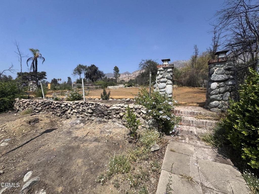 Set against the foothills of Altadena, this rare land offering presents a fresh start after the property was lost in the recent fires. Spanning nearly a quarter acre, the lot provides ample room for a new custom build, ADU potential, or a thoughtfully designed estate surrounded by nature. Although the address fronts Lake Avenue, the home's entry is privately situated on Athens Street, offering a more intimate neighborhood feel with convenient access.