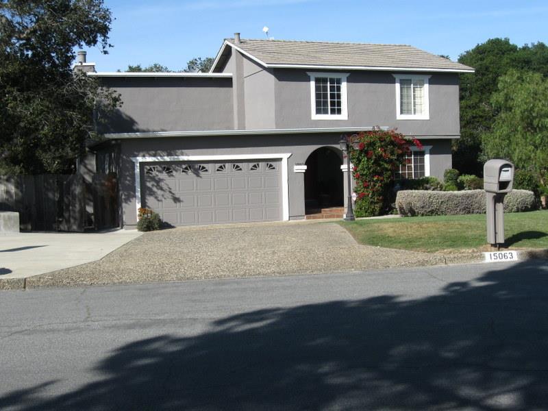 This beautifully cared for home is a real gem from its unique tiled front porch to the charming step-down Family room with its focal point fireplace. Downstairs, easy care Travertine tile floors cover most of the area including the alcove, Family room, half bath, and the very large country style kitchen. A Trex deck off the Family room leads to a patio area on the wooded lot--a perfect spot for entertaining. Guest parking. beautiful landscaping, and a great place to call home!