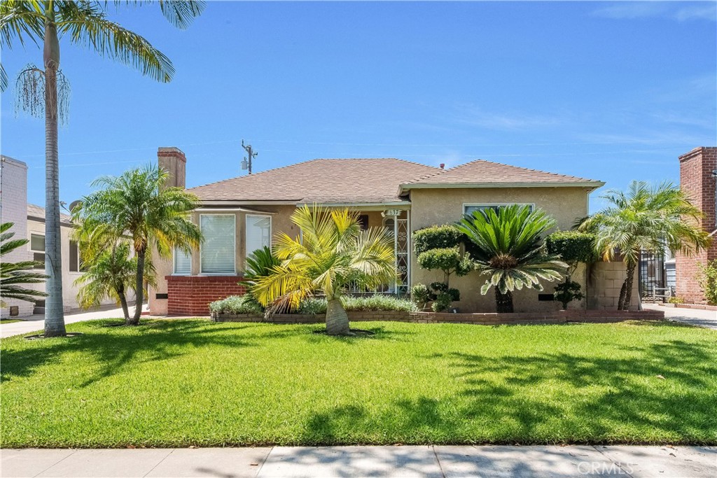 Welcome to 637 N Leonard St, a beautifully maintained residence located in the sought-after Bella Vista neighborhood of North Montebello. This classic home boasts charming curb appeal with a picture-perfect manicured front lawn, complemented by mature and dwarf palm trees that frame the entry.
Step inside to a timeless formal living room featuring a beautiful original fireplace mantle and an elegant bay window that fills the space with natural light. The adjoining formal dining room is enhanced with classic ceiling molding, perfect for hosting family and friends.
The kitchen is equipped with recessed lighting, granite countertops, and ample cabinet and counter space, seamlessly flowing into a casual living room—ideal for everyday comfort.
Generously sized bedrooms offer abundant natural light, creating a warm and welcoming atmosphere throughout the home.
The low-maintenance backyard is finished in pavers and surrounded by lush tropical landscaping, featuring a large awning to provide shade on warm summer days. A detached garage at the rear offers excellent ADU potential, adding value and flexibility to this already exceptional property.
