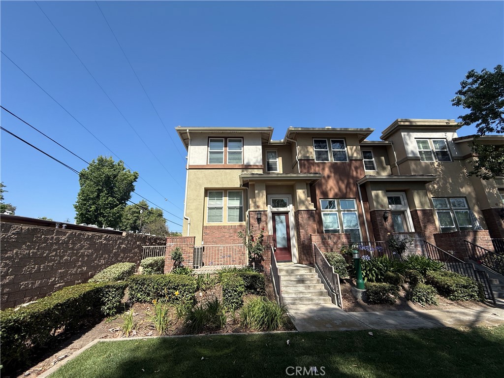 Welcome to Village Park, one of Claremont’s most desirable communities! This spacious tri-level condo offers 3 bedrooms, 2.5 bathrooms, and 1,674 square feet of flexible living space. The main level features a comfortable living room with a cozy fireplace and sliding doors that open to a private patio—perfect for relaxing or entertaining. Just off the garage entry, you'll find a bonus room ideal for a home office, gym, or guest space—a great flex area that adds to the home’s versatility. On the mid-level, enjoy a bright dining area and a well-equipped kitchen with generous cabinet and counter space, plus a convenient half bath for guests. Upstairs, the spacious primary suite includes a private en-suite bathroom and ample closet space. Two additional bedrooms and a full hall bath complete the upper level. The attached 2-car garage offers direct interior access for added convenience. Village Park is known for its peaceful, park-like setting with greenbelts, walking paths, and a sparkling community pool. Located within the award-winning Claremont Unified School District and just minutes from the Claremont Colleges, Village shopping and dining, and the Metrolink station, this home blends comfort, location, and community living. Don’t miss your chance to own in one of Claremont’s most welcoming and well-maintained neighborhoods!
