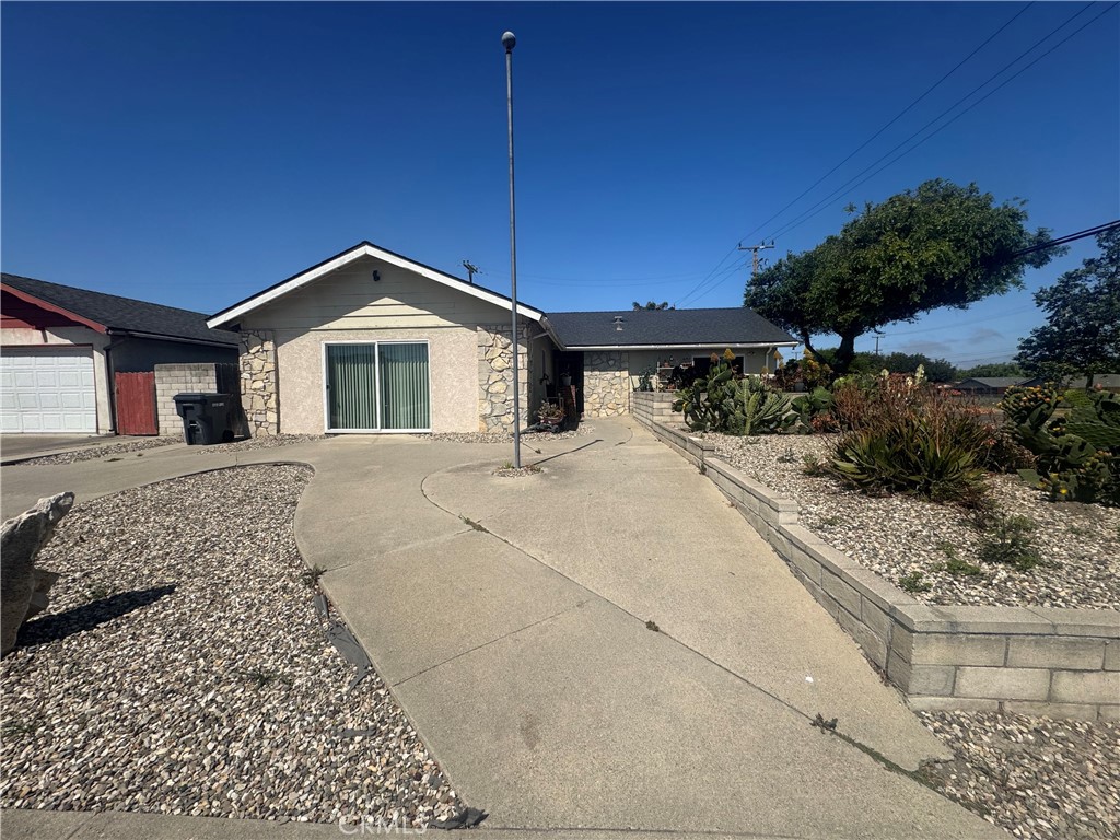 Great investment property in a desirable neighborhood on the south side of Lompoc. Spacious 3-bedroom & 2 bathroom house with garage legally converted into living space. Two of the bedrooms are oversized and either can be the primary room - one with a large bathroom and private patio & the other with a walk-in closet and sliding door leading to the backyard. Great corner lot with side street access and oversized carport in the backyard. This home is near parks & schools and is also conveniently located near Old Town Shopping with easy access to Vandenberg Space Force Base. PROPERTY TO BE SOLD IN ''AS-IS'' CONDITION.