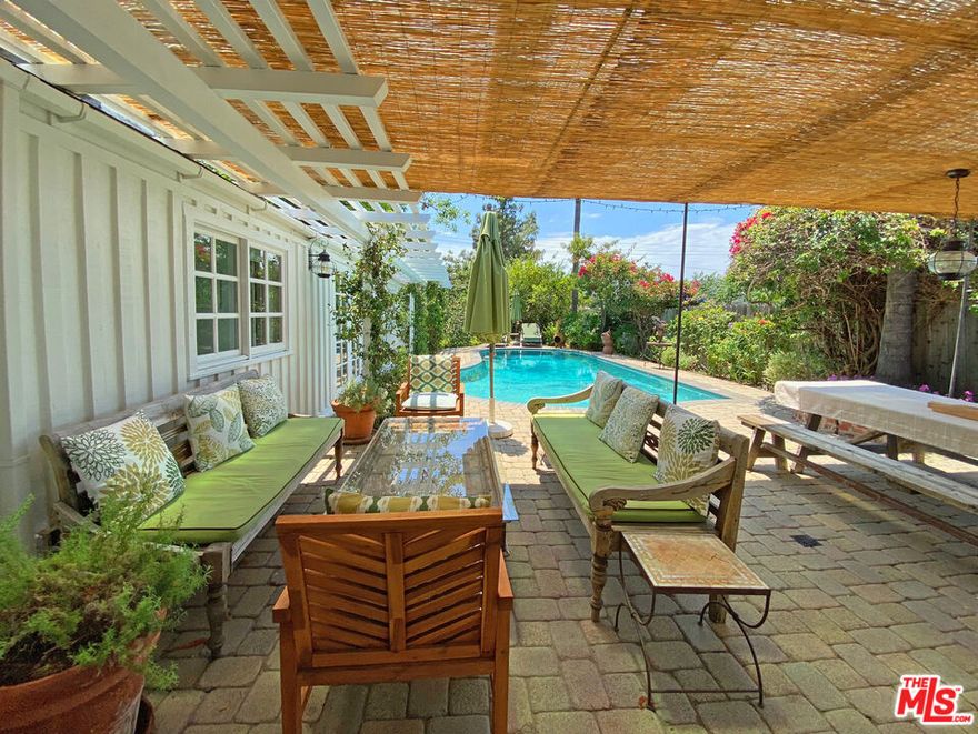 This property ticks all the boxes! Absolutely fabulous 3 bedroom ranch-style home in the Hollywood Hills with private gated grounds, complete with intercom and security cameras. The house is filled with natural light with stunning views over the valley from the deck. Entering the house one is greeted to an open plan living room, kitchen and dining area. The high vaulted ceiling, light hardwood floors and fireplace gives the home a farmhouse feel that is warm and inviting, perfect for entertaining. The fully equipped chefs kitchen  with a  center island and bar stools is  great for friends and family to gather around while cooking!  French doors off the living room lead out to the completely private swimming pool and outside dining area. The gardens are beautifully landscaped, featuring palms, lemon trees, olive trees, and lavender. A wooden dining table (seats 12), and  gas BBQ along with a shaded sitting area, umbrellas and lounge chairs, create a zen-like oasis for easy entertaining and relaxing. The tranquil primary bedroom features a king size bed and en-suite bathroom with a walk in shower and bath. The other two double bedrooms share a Jack and Jill  bathroom, complete with bath and shower. All bedrooms have flat screen HDTV's with Cable network and Wifi throughout the home. There is an additional powder room adjacent to the living room.  The home is centrally located, walking distance to the coveted Blue Ribbon Carpenter Avenue Elementary School, and an abundance of Ventura Boulevard shops and lively restaurants. The garage is available for one car, additional parking on street. Available August 1st 2024