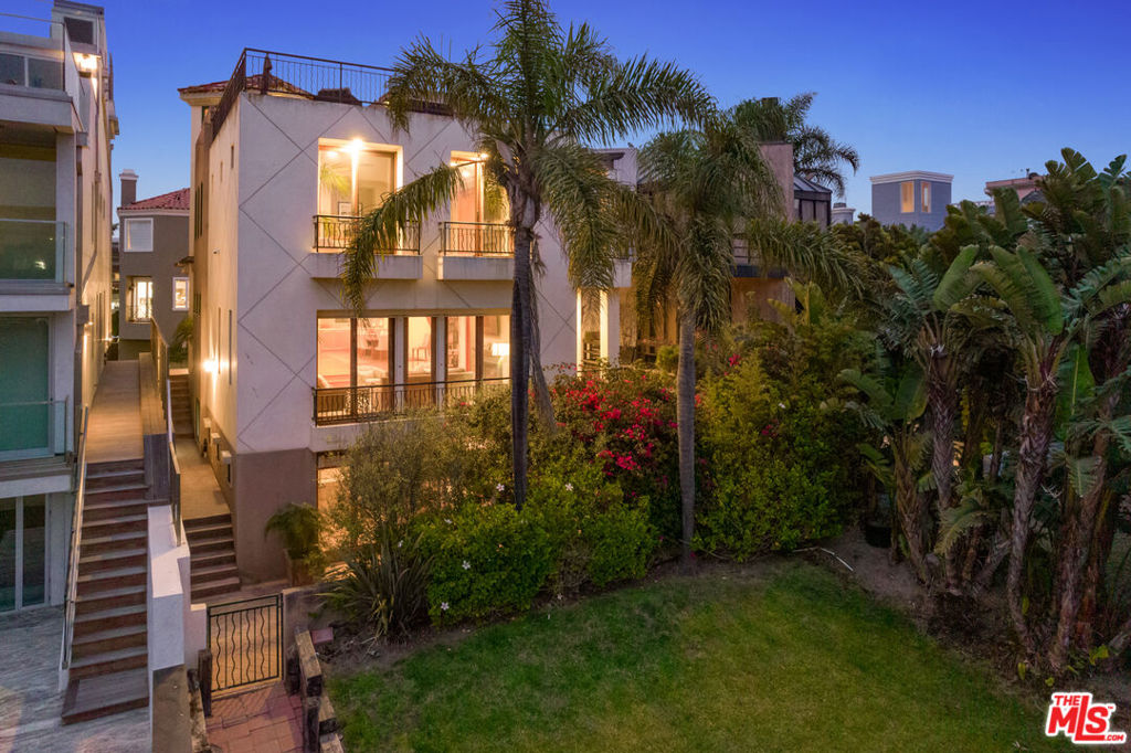 Luxury and coastal charm meet at this stunning canal front residence in the heart of the Silver Strand. With breathtaking views of the canal, iconic bridge, and peak-a-boo ocean views, this refined home blends elegant design with effortless California living. A copious amount of windows throughout the home flood each room with natural light, showcasing the serene water views and enhancing the open, airy ambiance. The thoughtfully designed floor plan includes a spacious media/bonus room on the lower level that opens directly onto a private patio, perfect for casual entertaining or peaceful relaxation. This outdoor retreat seamlessly connects to the scenic walk path that lines the tranquil canal, offering a unique blend of privacy and accessibility. Guests are welcomed by a generous 3 car garage and can take the elevator directly up to the sunlit open layout in the main living area, where they'll discover an inviting space adorned with custom finishes, a bespoke bar area, and multiple balconies to enjoy the fresh coastal breeze. The chef's kitchen flows effortlessly into the living and dining spaces, ideal for both everyday living and entertaining. Upstairs, the expansive primary suite serve as a personal retreat with a soaking tub, spacious shower, and a gracious walk in closet. Ample guest rooms on 3rd level connected by Jack and Jill bathroom. Take the stairs up to the rooftop deck where it serves as a true showstopper, complete with an outdoor kitchen and built in barbecue, it's the perfect setting to host gatherings or unwind while watching the sunset and glimpse of the ocean. This exceptional home offers the ultimate Marina del Rey lifestyle, just moments from the beach, local shops, and renowned dining, while nestled in one of the most picturesque and private settings the Silver Strand has to offer.