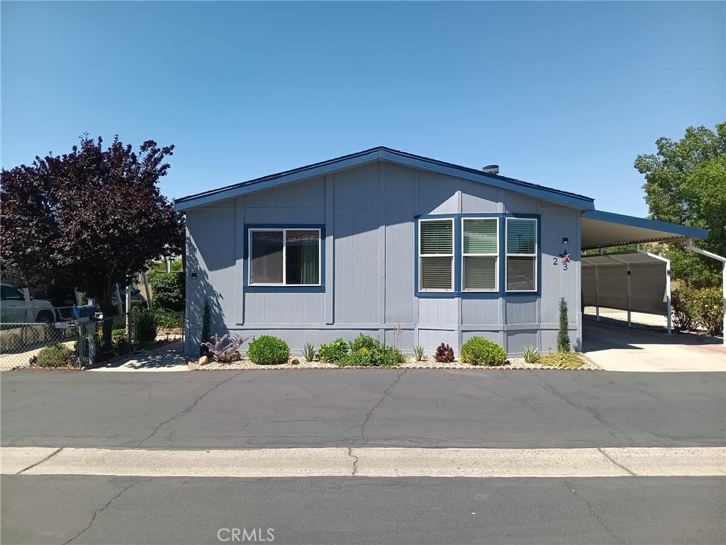 Step into a world of comfort and charm with this beautifully upgraded 3-bedroom, 2-bath manufactured home that perfectly blends modern convenience with a warm, welcoming atmosphere. As you enter, you’ll be greeted by the elegance of upgraded flooring and fresh paint that sets a serene backdrop for your new life. The open-concept kitchen flows seamlessly into the spacious living room, making it an ideal space for entertaining or cozy family gatherings. A separate family room offers additional space for relaxation or play, ensuring everyone has their own retreat. The pride of ownership shines through in every detail, from the updated bathrooms to the lush, landscaped yard, which boasts flourishing vegetable and herb gardens, perfect for the green thumb in your family. Your furry friends will love the fenced yard that provides a safe haven for outdoor play, while the upgraded shaded porch invites you to unwind with a good book or savor your morning coffee in the refreshing breeze. Nestled within a gated community, you’ll enjoy access to a clubhouse and pool, offering a lifestyle of leisure and connection at an affordable price. This home is not just a residence; it’s a sanctuary waiting for you to create lasting memories. Don’t miss the chance to make it yours!