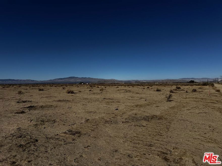 Discover 2.5 acres of open, usable land in a peaceful rural setting surrounded by wide desert skies and natural beauty. This versatile A-2-2 zoned parcel offers an excellent opportunity for agricultural projects, a future custom residence, recreational use, or long-term investment. The property features dirt road access with utility poles lining the frontage area, offering flexibility for future utility planning. Its level topography supports easy site design and development, while the expansive views create a quiet retreat away from the busier parts of the valley. Ideal for buyers seeking space, privacy, and the ability to shape a property according to their vision. A great option for those looking to expand agricultural operations, establish a rural homestead, or hold land in a growing region of the Antelope Valley. Buyers and agents to do their own due diligence.