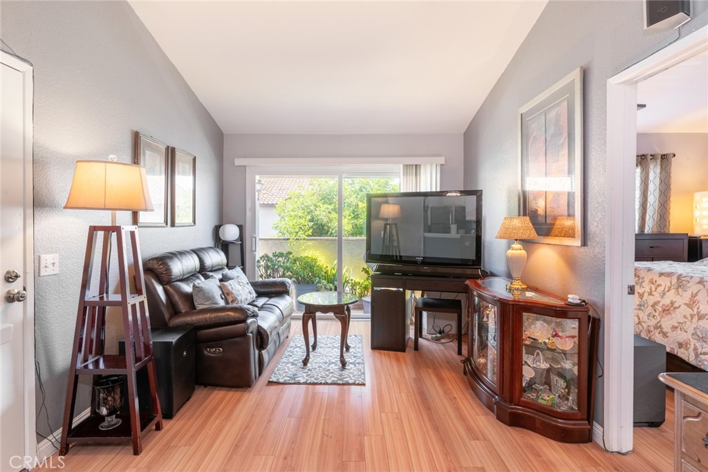 Welcome to 26205 La Real Unit E — a beautifully maintained upper-level end unit located in the desirable Las Palmas community of Mission Viejo. This charming 1-bedroom, 1-bathroom condo offers a spacious, open layout with a perfect blend of comfort and functionality.
Enjoy the bright and airy living space featuring vaulted ceilings, updated flooring, and an open-concept design that connects the living room to a private balcony — ideal for relaxing or entertaining. The kitchen includes stainless steel appliances, ample cabinet storage, and a breakfast bar that opens to the dining area.
The spacious bedroom features a walk-in closet and an en-suite bathroom with modern finishes. Additional highlights include in-unit laundry, central A/C and heat, and a covered carport (Space #82) conveniently located just steps from the unit.
Community amenities include two pools, a spa, and Lake Mission Viejo membership, offering year-round recreation like boating, fishing, and summer concerts.
Centrally located near shopping, dining, parks, hiking trails, and top-rated schools, this home is a great opportunity for first-time buyers, investors, or those looking for low-maintenance living in South Orange County.
Don’t miss your chance to make it yours!