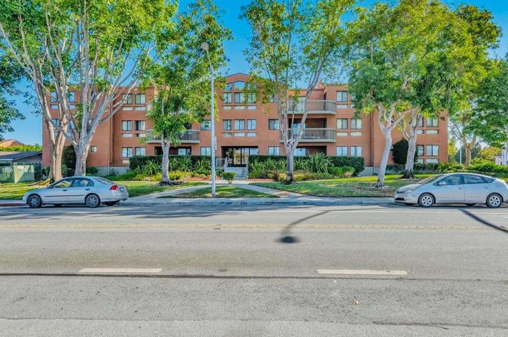 Bright and Spacious One-Bedroom Ground-Floor Corner Unit with Park Views Rare ground-floor corner end unit offering comfort, privacy, and modern living in one of San Mateos most desirable neighborhoods. Full wall of glass opens to a private balcony with serene Lake Shore Park views. Perfect for morning coffee, outdoor dining, or entertaining. Light-filled bedroom features corner-positioned double-pane windows, mirrored closet, and direct balcony access. Kitchen with stainless steel refrigerator, stainless steel electric stove, microwave, dishwasher, abundant cabinetry, and durable Formica countertops flows into the dining area. Tile entryway, plush carpet in living areas, and updated bathroom with marble-tiled lavatory, tasteful tile floors, and water-saving fixtures. In-unit washer and dryer, in-wall ironing board, baseboard heating, fire sprinkler system, and energy-efficient double-pane windows throughout. Private underground gated parking with elevator access. Owner covers water and garbage. One-year lease. Furnished option available for additional two hundred fifty dollars per month. Close to Highways 92 and 101, shopping, dining, and parks.