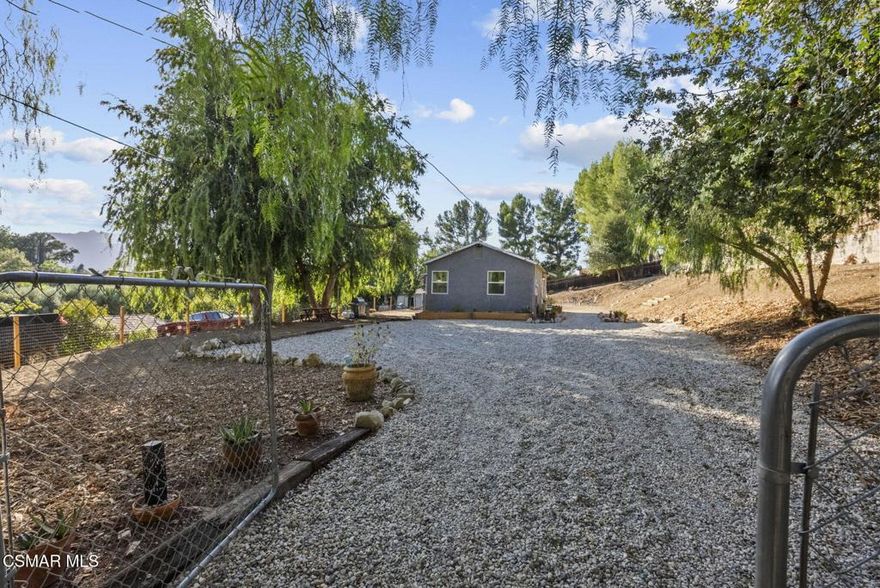 Welcome to 5429 Fairview Place, where modern comfort meets country charm in one of Agoura Hills' most sought-after neighborhoods. Tucked into the heart of Old Agoura, this beautifully remodeled 1 bedroom, 1 bath home offers 880 (per assessor) square feet of thoughtfully updated living space on a rare, over half-acre lot -- the perfect canvas to build your dream estate, expand the existing home, or simply enjoy a peaceful, rural lifestyle just minutes from the city.Remodeled in 2024, the home blends rustic character with contemporary style. Inside, you'll find a stunning knotty pine ceiling, original refinished wood floors, butcher block countertops, and recessed lighting throughout. The converted patio offers additional usable space and charm, while dual-pane windows, new doors, new drywall and insulation bring year-round comfort and energy efficiency. The all-electric design features newer stainless steel appliances, a mini split system for heating and cooling, and a newer washer/dryer. Motion lights and a gravel driveway add convenience, while raised garden beds inviting you to grow your own vegetables or flowers under the shade of mature trees. Surrounded by multi-million dollar estates, Old Agoura is a truly unique community. Known for its equestrian charm, wide open spaces, and relaxed pace, it offers estate living with the convenience of being minutes from the 101 freeway, top-rated Las Virgenes schools, and everyday essentials. The neighborhood features horse trails, a community park, riding arena, and direct access to the Chesebro/Palo Camado Canyon for hiking, mountain biking, and horseback riding with sweeping views of Ladyface Mountain. Whether you're looking to move right in, expand over time, or build your forever home -- this is a rare opportunity to own flat, usable land in one of Agoura's most prestigious and peaceful settings. Come experience the potential of 5429 Fairview. The possibilities are endless.