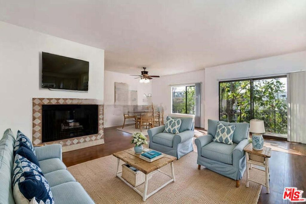 Wonderfully walkable, bright and spacious Brentwood condo in the friendly Elegance Kiowa complex just blocks to Brentwood Village. Upgraded corner 2 bed/2 bath with generous open plan overlooking the treetops. Laminate wood floors, gas fireplace, wet bar, dining area & updated kitchen w/stone countertops & stainless appliances. Expansive and private front-facing balcony on this peaceful street situated between San Vicente's chic restaurants, boutiques and beloved Farmer's Market and Wilshire Blvd's acclaimed restaurants, Bristol Farms, Whole Foods & shops. Serene primary bedroom suite w/large walk-in closet, private bath w/dual sinks, deep soaking tub and glass-enclosed shower. Comfortable second bedroom enjoys treetop vistas, walk-in closet and adjacent hall bath w/large shower. Two-car tandem parking, washer/dryer in unit, air conditioning, extra storage. Nice complex w/pool, spa, sauna, rec room, BBQ area, intercom entry. Ideal location close to UCLA, Santa Monica and the 405a rare opportunity to live in beloved Brentwood, one of LA's most delightful Westside communities. NOTE: Some photos virtually staged. Rental is unfurnished
