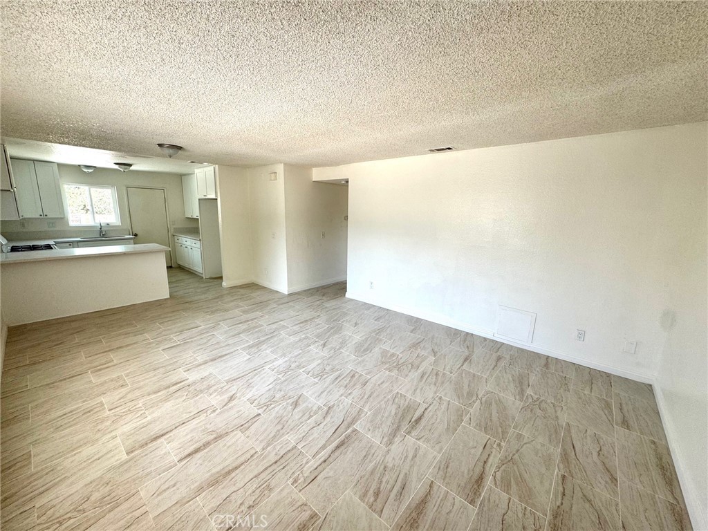 Discover your next home at 16214 Juniper St #3C in Hesperia, CA 92345. This beautifully remodeled 3-bedroom, 2-bathroom apartment offers modern living with a fresh, updated feel. Step inside to find brand new flooring throughout, giving the space a clean and contemporary look. The fully renovated kitchen features new cabinets and sleek countertops, perfect for both everyday living and entertaining. Fresh paint throughout the apartment enhances its bright and inviting atmosphere. With spacious bedrooms and updated bathrooms, this home combines comfort and style in a convenient Hesperia location. Ready for immediate move-in, this apartment offers a perfect blend of modern upgrades and everyday functionality.