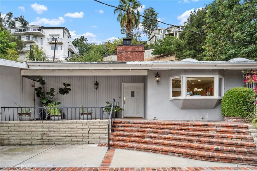 This mid-century modern home presents a rare chance to own and reimagine south of the boulevard in a highly desirable neighborhood. The post and beam construction and open design create a warm, bright and inviting atmosphere, evoking a sense of timeless appeal.

This home is approximately 1,764 square feet of living space with three bedrooms and two bathrooms on a half an acre of land. The open concept layout provides a seamless flow between the living areas, allowing for versatile and comfortable living.

The generously sized primary bedroom with ensuite bathroom provides a peaceful retreat, while the additional two bedrooms and bath offer flexible space for a home office, guest suite or additional living areas. 

The home is situated in a desirable neighborhood south of Ventura, offering a private and tranquil setting. Set back from the street with tree top views, this property provides a serene and picturesque backdrop to everyday life.

The sought-after neighborhood allows for easy access to Calabasas and Malibu with a range of amenities, including shopping, dining and recreational opportunities. This home presents an ideal living environment for those seeking the opportunity to join this great neighborhood with all it has to offer and revitalize this exceptional home to create a harmonious blend of mid-century and modern design. Don't miss this rare opportunity!