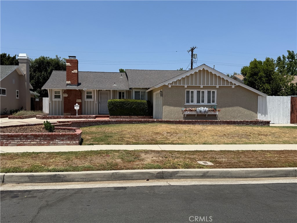 This beautifully maintained 3-bedroom, 2-bath home is located in the desirable Westridge Park neighborhood of Canoga Park. Offering 1,732 sq. ft. of living space on a spacious 7,510 sq. ft. lot, the home blends original character with thoughtful updates. Freshly painted inside and out, the home features a newer roof, adding to its overall value and curb appeal. Inside, the living room centers around a cozy custom stone fireplace, while the adjacent family room/den impresses with dramatic vaulted ceilings, wood beams, and direct access to the backyard through sliding glass doors—ideal for entertaining or relaxing. The kitchen offers plenty of functionality with tile countertops, custom cabinetry, a breakfast bar, and a bay window overlooking the backyard. It also includes newer appliances, including a refrigerator and recently installed dishwasher. Off the kitchen is a dedicated laundry room with washer, dryer, and a newly installed door that leads outside. The primary bedroom suite features a walk-in closet and a ¾ bath with modern updates, and connects conveniently to the entryway. Down the hall are two additional bedrooms—one with its own walk-in closet—and a full bathroom. Additional features include: Custom glass cabinetry near the dining area, Attached 2-car garage, Spacious backyard with lots of potential for future landscaping or expansion, brand new electric panel. This quality-built home offers timeless charm in a historically rich neighborhood, making it a great opportunity for any buyer looking for comfort, space, and long-term value. Seller has approved plan and Permit for garage conversion to ADU.