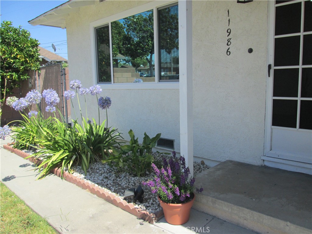 Step inside this charming, meticulously maintained 3 bedroom, 2 bath home that blends comfort and convenience. Many recent updates include new copper plumbing, upgraded 200-amp electrical box, double-pane privacy windows, new blinds throughout and fresh interior paint. This home offers a modern and inviting atmosphere with all the mechanical systems already upgraded. The new a/c & heating system ensures year-round comfort while recessed lighting and added insulation enhance energy efficiency and style. The attached 2 car garage has been completely refurbished with new concrete floor, insulation, dry wall, and recessed lighting providing an option for additional space. New garage door & opener plus new enlarged concrete driveway. New water heater relocated outside with an outdoor sink. The original hardwood floors throughout have been refinished adding lots of character. Perfectly positioned in a quiet, desirable neighborhood, this home is just a short stroll from shopping, dining, parks and entertainment options. Close to Biola University and Regional Park. This home provides the ideal balance of tranquility and accessibility.