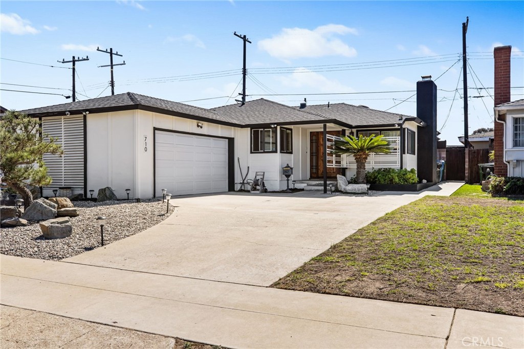 This beautifully upgraded 3-bedroom, 2-bathroom single-level home is ideally situated in the North Gateway neighborhood of Gardena—a location known for its unbeatable convenience and proximity to everything Southern California has to offer. Whether you're commuting to Downtown Los Angeles, heading west to Redondo or Manhattan Beach (just 8 miles away), or hopping on one of the many nearby freeways, this home puts you right in the heart of it all. From the moment you arrive, you'll notice fresh exterior paint, a roof under 10 years old, and drought-tolerant landscaping creating eye-catching curb appeal with low-maintenance benefits. Inside, the home has been thoughtfully redesigned to open up the living space—walls removed to create a seamless flow between the kitchen, dining, and living areas. complete with real white oak flooring, honoring the home’s vintage 1950s character, and now enhanced with modern recessed lighting and a striking black marble fireplace—a true focal point that brings warmth and sophistication. The remodeled chef’s kitchen is a standout feature, showcasing a large granite island, soft-close cabinetry, a charming farmhouse sink, and upgraded appliances that make cooking and entertaining a joy. All three bedrooms offer generous space and comfort. One secondary bedroom includes a closet organizer, while the primary suite is outfitted with a custom-built closet system and an elegantly upgraded ensuite bathroom. The second bathroom has also been tastefully updated with frameless glass shower, new vanity, and features a soaking tub—a perfect place to relax after a long day.. From the living room, Slide open the upgraded 3-panel accordion glass door and step into your private backyard oasis. A freshly stained redwood deck, fruit-bearing trees, and plenty of space to entertain or unwind create the ideal outdoor living environment. Enjoy year-round comfort with a newer HVAC system (2017), an upgraded electrical panel (2024), and dual-pane windows throughout. For lifestyle lovers, the home is located just 2 miles from The Enclave, a vibrant hub offering curated restaurants, outdoor entertainment spaces, art installations, and regular community events. This home checks all the boxes: style, smart updates, comfort, and a location that puts you minutes from the beach, the city, and everything in between.