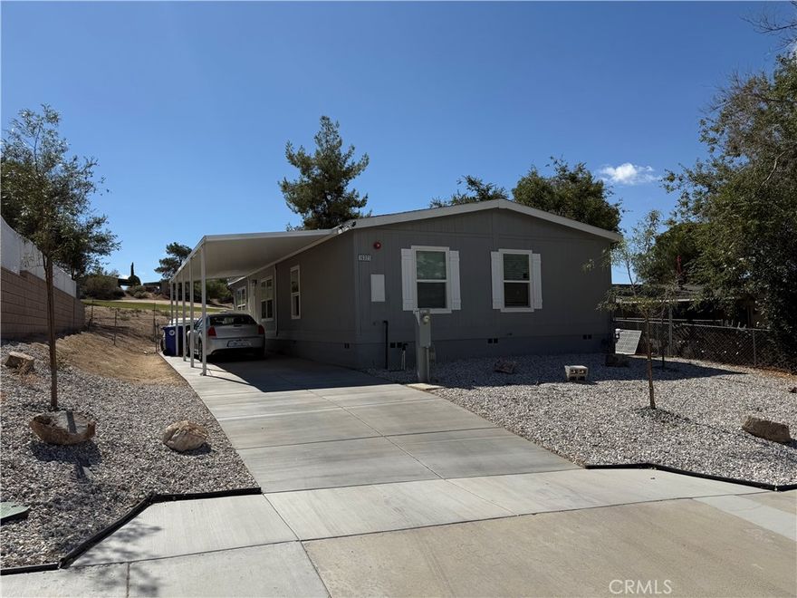 2024 3bedroom 2bath home. Golf course out back, lovely view of park across the street, Open floorplan, recessed lighting, kitchen has island, huge separate dining area. Great for those family dinners. Perfect starter home. Large 10x40 carport with landscaped front yard. This home features 1568sf living space. Barn doors leading to laundry room off kitchen, blinds throughout home.