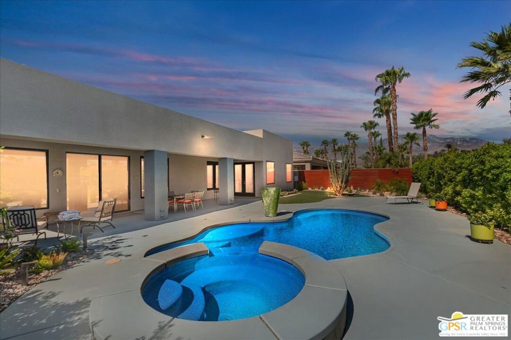 Welcome to this beautifully updated 4-bedroom, 4-bathroom home in the prestigious gated community of Montage at Mission Hills in Cathedral City. This stunning residence features a detached casita, perfect for guests, a home office, or a private retreat. Inside, the home has been thoughtfully renovated with new tile flooring throughout and fully remodeled bathrooms that blend style and functionality. A dramatic floor-to-ceiling granite fireplace wall anchors the spacious living area, while newly installed, unobstructed dual-pane windows bring in abundant natural light and frame scenic views. The kitchen is equipped with newer upgraded appliances, including a premium Wolf gas cooktop range, and opens seamlessly to the living and dining areas ideal for both entertaining and everyday living. Additional upgrades include newer zoned central air and heating systems, zoned water heaters, and bathroom skylights that brighten the interior. The garage has been enhanced with a newly painted floor and is equipped with a dedicated car charging station, offering convenience for electric vehicle owners. The home also includes a leased solar energy system, providing both sustainability and cost efficiency. The private backyard is an entertainer's dream, featuring a sparkling saltwater pool and spa, along with stunning mountain views that create a serene and luxurious outdoor living experience. As a resident of Montage, you'll enjoy low HOA dues that include a Social and Fitness Membership to Mission Hills Country Club, with golf access available separately. This move-in ready property offers a rare combination of luxury, comfort, and location in one of the Coachella Valley's most desirable communities.