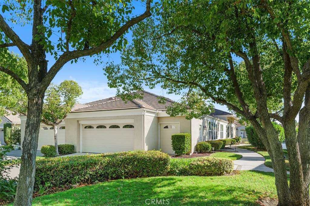 Lakefront unit with stunning 180 degree views. Located in the Country Club Lakes this unit has the prime location. Estimated at over 1900 sq ft after atrium enclosure, all on one single level. Fully remodeled unit from front to back with quality features and products including new windows throughout and new glass patio railing. Stunning kitchen with stainless steel appliances, lighting in upper glass door cabinets, custom crown molding, center island, quartz counters and see through fireplace. Living room with fireplace, lake views and slider leading to private patio. Separate dining room and office with french doors for privacy. Primary suite and en suite bath include: shutters, two separate closets, walk in shower, two separate sinks and center floating soaking tub……. better than going to the spa. Secondary bedroom with walk in closet and door to bathroom. Also featuring a den/3rd bedroom (no closet), your choice. Fabulous patio and extended decking over the lake perfect for entertaining or just relaxing. Two car garage plus golf cart garage with plenty of storage. This home is stunning on its own, add the premium location and it’s one of a kind….