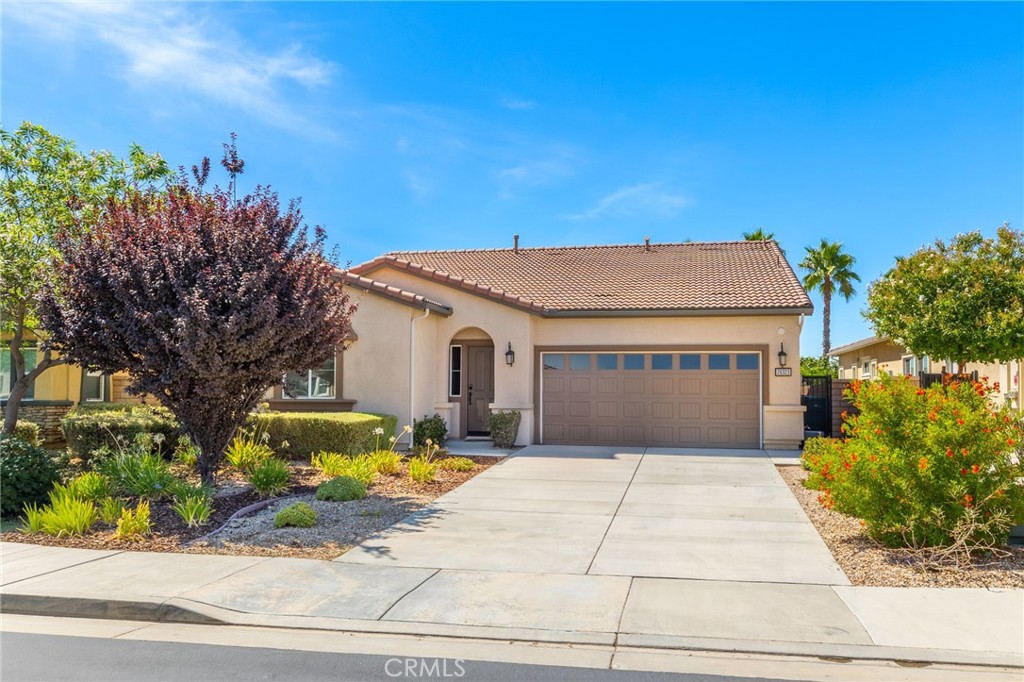 Welcome to this beautifully upgraded home located in a gated 55+ community, offering 2 bedrooms, a den, and 2.5 bathrooms. Thoughtfully designed with modern finishes and functional enhancements, this home is move-in ready with luxury details throughout and includes energy-efficient leased solar.The kitchen showcase premium granite countertops, full backsplash, upgraded sinks, and faucet, while the great room features a custom media center with a 7-foot linear electric fireplace. Throughout the home, you'll find premium porcelain tile flooring, crown molding, and base molding for elegant finish. Enjoy year-round comfort with a whole house fan cooling system and an 8-zone wireless backyard irrigation system. Outdoor living is designed for both entertaining and convenience with California room finished in professional epoxy coating, two underground gas lines for future BBQ's or firepits, and two 20-amp circuits with six outlets providing full backyard coverage. Additional upgrades includes rain gutters connected to underground drains, professional epoxy flooring in the garage, overhead storage racks for organization.This community provides convenience and peace of mind with HOA-maintained front yards, as well as access to amenities including swimming pool. This property is located just minutes to shopping centers and freeway.