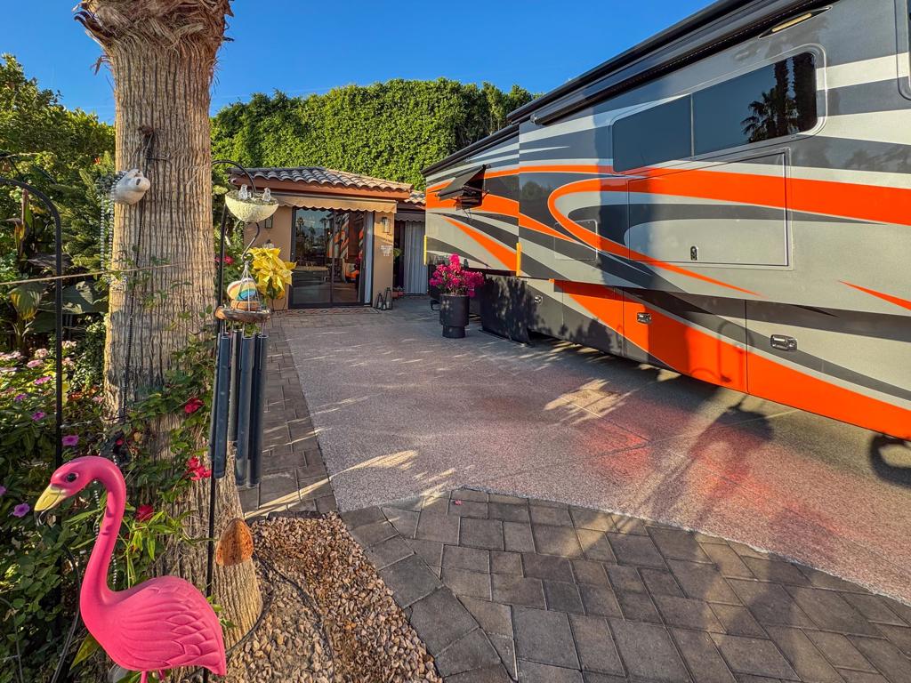 Discover unparalleled luxury and comfort at this exceptional RV lot at Outdoor Resort Indio, where quiet privacy meets sophisticated design. Nestled next to a pet area for added convenience, this lot features a sparkling epoxy RV pad, pavers, and potted flowers with drip irrigation. At its heart is a stylish, newly built (2023) 472 sq. ft. casita that exudes modern elegance and thoughtful craftsmanship. With extending awnings for additional outdoor living space, this retreat is perfect for entertaining or relaxing in complete privacy.Inside the casita, you'll find a spacious living and dining area, a large kitchen with a central island, and custom leather-finished granite countertops--a true must-see. Fully furnished and adorned with curated wall art, the casita includes a sleeper couch, a full-size fridge, recessed lighting, a chandelier, and sconces for a warm ambiance. The luxurious full-size bathroom boasts a large shower and ample storage, while the laundry and wardrobe room add practicality. With tile flooring, new paint, modern lighting, every detail has been designed for comfort. Extend your stay at ORI with the built in AC and heat system. This one-owner casita is move-in ready, complete with all appliances and a TV, offering the perfect blend of style, privacy, and luxury RV living. Outdoor Resort Indio is a class A only RV resort.