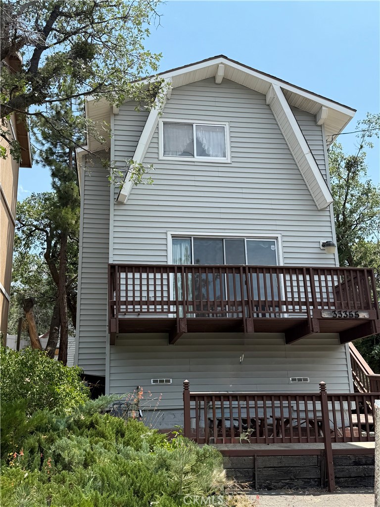 Welcome to this cozy 2-bedroom, 1.5-bath mountain home, nestled in the heart of Arrowbear Park. Just a short walk to the seasonal lake, this two-story retreat offers the perfect blend of convenience and mountain charm. Ideally located near a community park with a baseball field and playground equipment, and within walking distance to a local restaurant, this property offers both relaxation and recreation right at your doorstep. Inside, you’ll find a functional layout with living spaces on both levels and a cute little eating bar that connects the kitchen to the living area—perfect for casual meals or chatting with guests while you cook. Step outside onto the large deck and take in the gorgeous mountain views—the ideal spot for morning coffee, evening sunsets, or entertaining in the fresh mountain air. This home is well-suited for full-time living, a weekend getaway, or an income-generating investment. While it could use a little TLC, there’s great potential to make it your own mountain retreat. Whether you’re seeking peace and quiet or a fun-filled escape close to nature, this Arrowbear gem offers endless possibilities!
