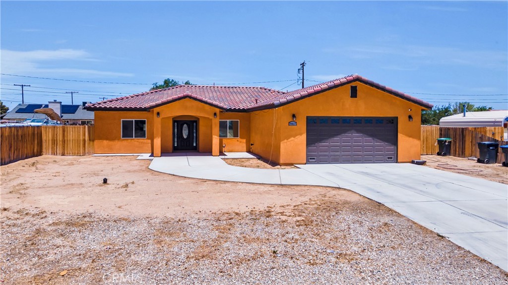This stunning 4-bedroom, 3 bathrooms custom home is just 5 years old and packed with rare amenities and modern upgrades. Featuring a durable tile roof and gorgeous laminate flooring throughout, it's built for both beauty and easy maintenance-perfect for high-traffic living. The home boasts two master suites, including one located at the front of the house-ideal for rental income, a private home office, or in-law quarters. The open-concept layout with soaring 9-foot ceiling creates a spacious, inviting feel, complimented by a high-end kitchen with upgraded cabinetry and quartz countertops. Enjoy seamless indoor-outdoor entertaining with a stucco-finished, covered patio and slab. Additional features include natural gas, city water, and for a convenient 20-minute commute to the north gate of Edwards Air Force Base. This rare find blends comfort, function, and style-perfect for growing families or multigenerational living.