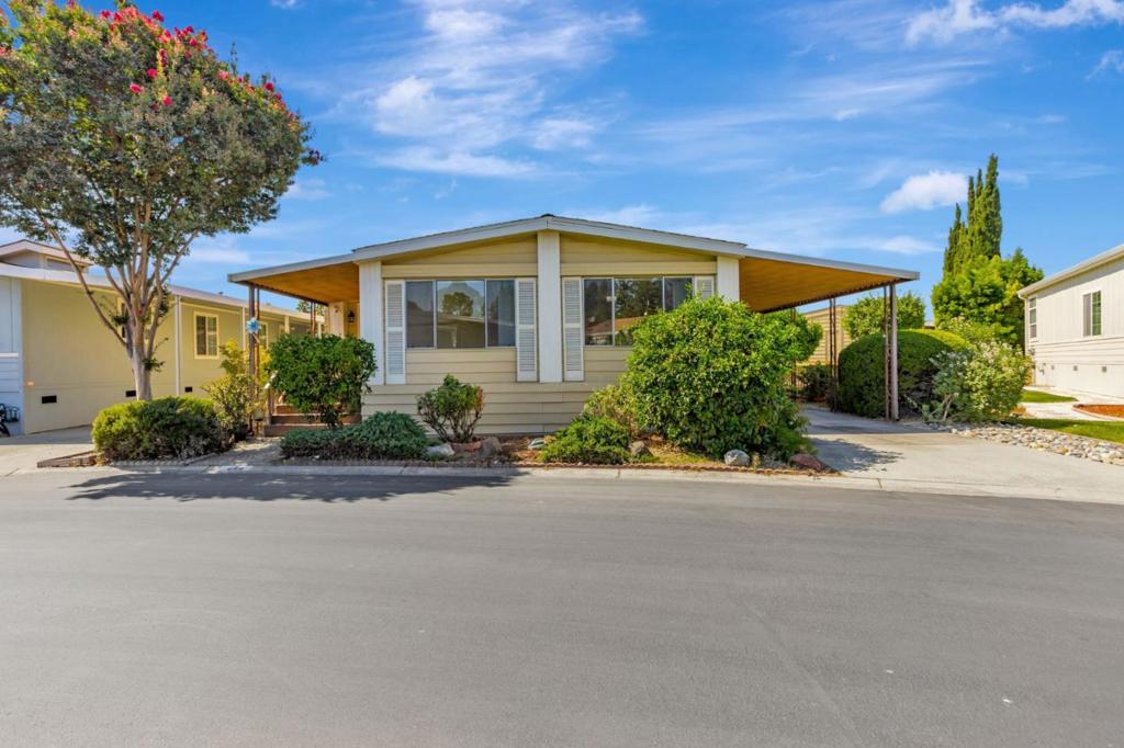 Located in the prestigious 55+ community of Millpond in San Jose, this beautifully updated 3 bedroom, 3 bathroom home is now available. Step inside to find a spacious living room, cozy family room, formal dining area, and an open kitchen featuring rich cabinetry and stainless steel appliances. Large windows throughout fill the home with natural light, while laminate flooring adds a warm, modern touch. The primary suite offers a generous mirrored closet and a private bathroom with dual vanities and a shower/tub combo. The secondary bedroom is comfortably sized with ample closet space. A large laundry room with cabinetry and counter space provides extra storage and convenience. Enjoy outdoor living on the expanded porch, perfect for entertaining or relaxing. Embrace the sense of community with nearby walking paths and parks, while enjoying the convenience of being just moments away from shopping and dining options.