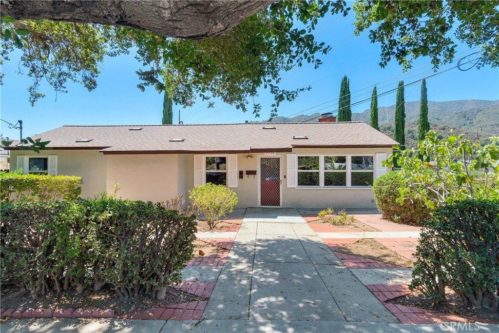 This lease listing is for the front house which is a lovely 2-bedroom + 2-bathroom home located in wonderfully serene La Crescenta neighborhood. The home is full of natural light thanks to its large windows. The kitchen has lots of counter space, plenty of cabinets and an under-sink water filtration system. In addition to the living room / dining area with its real fireplace, this rental also features an indoor laundry area with washer/dryer hookups and lots of extra storage space. 3352 Montrose Avenue offers convenience and accessibility to a host of amenities, including top-rated schools, parks, shopping and dining. In addition to the main house (3352 Montrose), the property also has a fully self-contained, permitted ADU (3352 1/2 Montrose), which is approximately 400 sq. ft. The ADU, which is being leased out separately for $1600, has its own covered parking spot and separate entrance.
