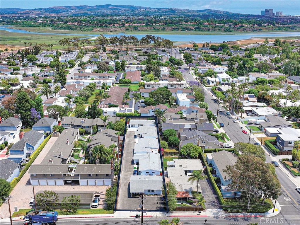 We are pleased to present 2414–2422 Santa Ana Avenue, a fully renovated five-unit property located in the heart of Eastside Costa Mesa, right on the edge of Newport Beach. This rare, generational investment features five detached, bungalow-style 3-bedroom homes—each offering the privacy and comfort of a single-family residence with the operational simplicity of a multifamily asset. Sited on an expansive 17,038 square foot lot, the property includes four 3-bedroom, 1-bath units—three with enclosed garages—and one 3-bedroom, 2-bath unit with a large private yard. Originally built in 1952 and completely renovated and stabilized in 2025, the owner spared no expense in the updates. Each unit showcases brand-new appliances, granite or quartz countertops, stylish wood laminate flooring, and in-unit washer and dryers. With a cohesive aesthetic and market-rate rents in place, the property is 100% occupied and offers immediate, strong cash flow. Ideally situated near 17th Street’s shops and restaurants, the Upper Newport Back Bay, top-rated public schools, and major freeways, this location is one of the most desirable in Orange County. Additionally, the property is adjacent to Newport Boulevard’s Measure K corridor, which is poised for significant future redevelopment. Offering turnkey condition, prime location, and long-term upside, 2414–2422 Santa Ana Ave is a truly exceptional investment opportunity in a high-demand coastal market.