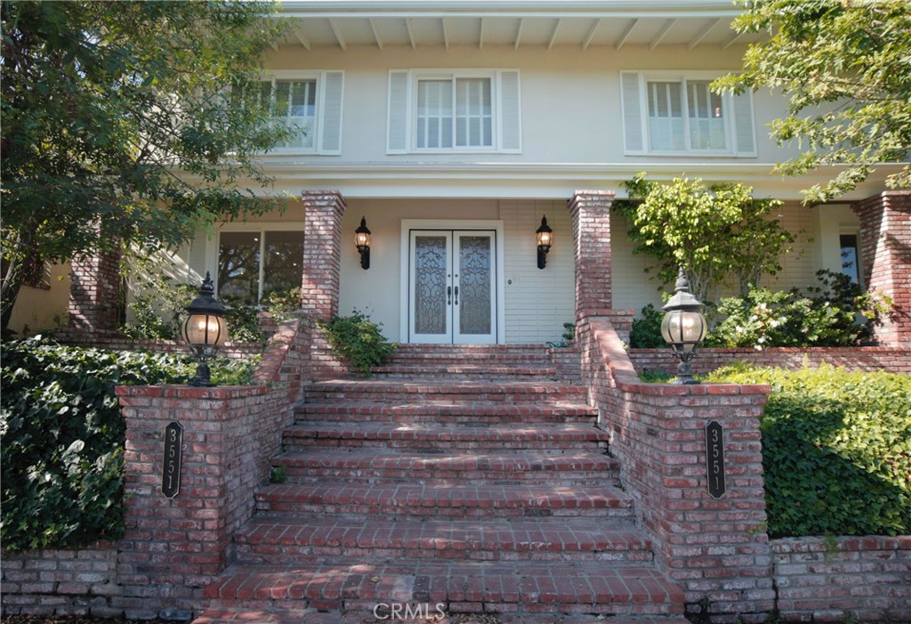 This breathtaking two-story home boasts a pool and offers panoramic views of the Encino Hills. It features four bedrooms, two full bathrooms and two half bathrooms, and spans 2,952 square feet of living area on a vast 34,330 square foot lot. The double-door entry opens to a bright floor plan with abundant windows. The home is equipped with premium flooring, smooth ceilings, recessed lighting, plantation shutters, designer lighting fixtures and newer appliances. Both the living and family rooms have cozy fireplaces. The bedrooms are roomy, with the master bedroom offering a large en-suite bathroom and 2 walk-in closets. The 2-car garage is attached and has convenient direct access into the home and also has a storage room. A generous patio provides the perfect setting for outdoor dining against the backdrop of stunning sunsets. The inviting pool is ideal for relaxation and outdoor enjoyment. Pool and gardening serves are provided by the landlord.