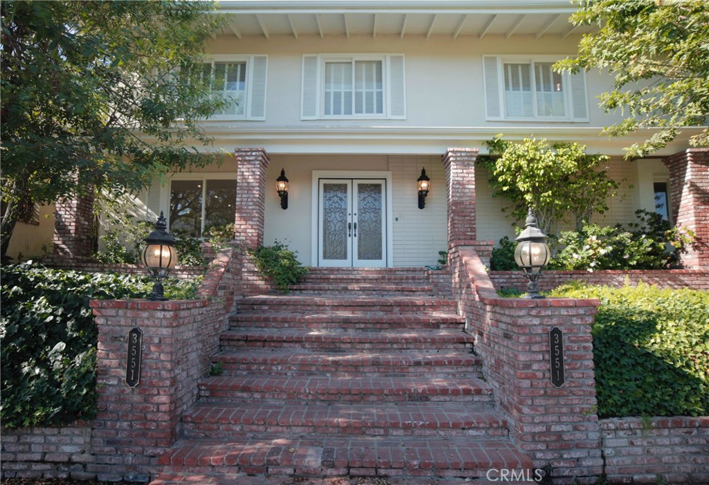 This breathtaking two-story home boasts a pool and offers panoramic views of the Encino Hills. It features four bedrooms, two full bathrooms and two half bathrooms, and spans 2,952 square feet of living area on a vast 34,330 square foot lot. The double-door entry opens to a bright floor plan with abundant windows. The home is equipped with premium flooring, smooth ceilings, recessed lighting, plantation shutters, designer lighting fixtures and newer appliances. Both the living and family rooms have cozy fireplaces. The bedrooms are roomy, with the master bedroom offering a large en-suite bathroom and 2 walk-in closets. The 2-car garage is attached and has convenient direct access into the home and also has a storage room. A generous patio provides the perfect setting for outdoor dining against the backdrop of stunning sunsets. The inviting pool is ideal for relaxation and outdoor enjoyment. Pool and gardening serves are provided by the landlord.