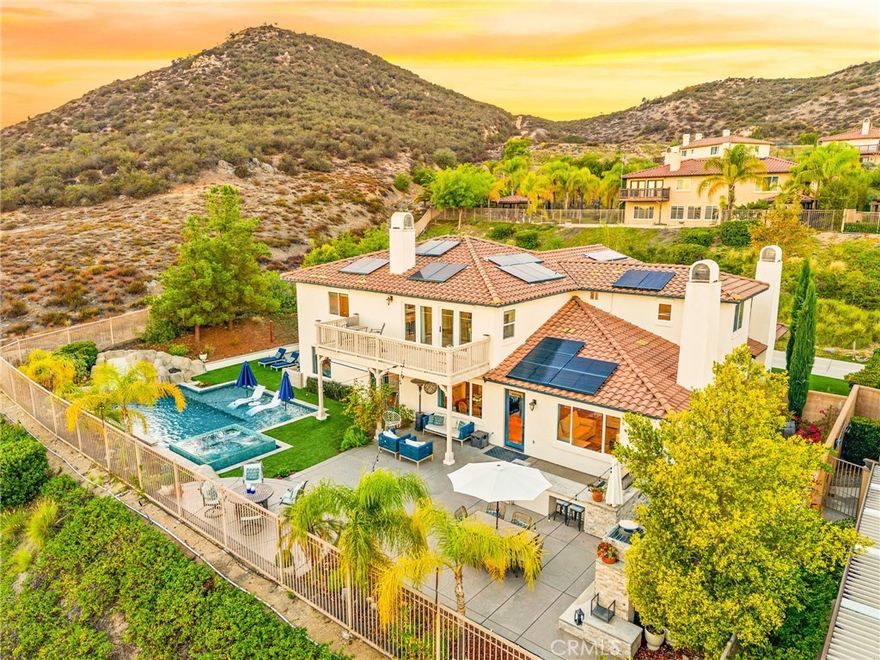 Welcome to this stunning 4,120 sq. ft. bespoke luxury home in the prestigious guard-gated community of Greer Ranch. Thoughtfully designed for both elegance and livability, this residence offers 5 bedrooms, 4.5 baths, plus a dedicated office, all showcasing breathtaking views of the Murrieta and Temecula Valley at the top of Greer Ranch.



The open and inviting floor plan features a main-floor mother-in-law suite with its own living area, bedroom, and private bath — perfect for guests or multi-generational living. The gourmet kitchen shines with granite countertops, stainless steel appliances, and refinished wood flooring laid in an elegant herringbone pattern, opening seamlessly to the family room and breakfast nook for effortless entertaining.



Throughout the home, all flooring has been beautifully redone, enhancing the cohesive, modern feel and complementing every space with refined style.



Upstairs, the primary suite serves as a tranquil retreat with sweeping views, a spa-inspired bathroom, and an oversized walk-in closet. Three additional bedrooms, including a private guest suite, offer comfort and flexibility for family and friends.



Step outside to your resort-style backyard oasis, where luxury and leisure meet. Enjoy a newer custom osmosis pool and spa with a PebbleTec finish and soft pool lighting, creating the perfect evening ambiance. The outdoor space features a balanced mix of concrete and lush artificial turf, ideal for both entertaining and everyday relaxation while taking in the spectacular valley views.



Additional highlights include solar power for efficiency and peace of mind.



Located within the highly sought-after Greer Ranch community, residents enjoy scenic hiking and well-known biking trails, a Jr. Olympic-sized pool, playgrounds, basketball courts, and year-round community events — all within a peaceful, guard-gated setting.



Experience refined living, thoughtful design, and unmatched views — all in one extraordinary Greer Ranch home.