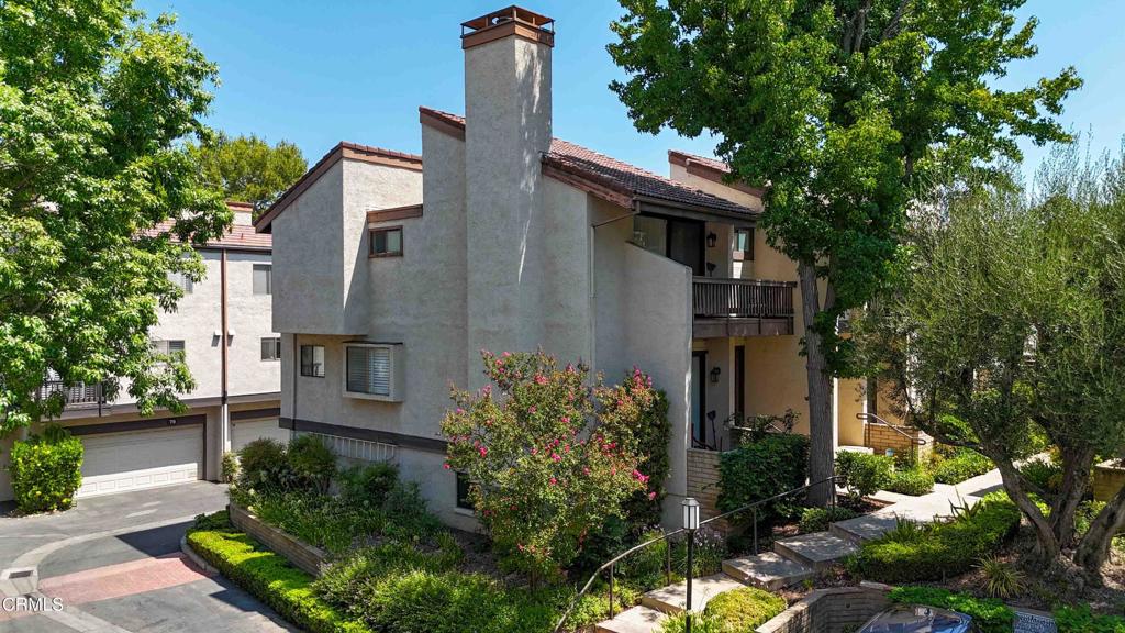 Gorgeous recently renovated, must see 3 bedroom, 3 bathroom home with bonus room, located in the beautiful Warner Village community of Woodland Hills. Front entry leads in to the open living and dining room featuring a high ceiling with recessed lighting, new paint, gorgeous new wood flooring, a fireplace with stone surround, and large patio windows providing great natural light. The renovated kitchen features new soft close cabinets and drawers, new quartz counters with high backsplash, long bar counter with pendant lights, new stainless steel appliances, new fixtures and a walk-out balcony. The second floor features the spacious main bedroom with dual closets (long extended & a walk-in), a large walk-out balcony, and an en-suite main bathroom with new cabinet, quartz counter, mirror, fixtures and lighting. Down the hall are the secondary bedrooms and bathroom with new cabinet, quartz counter, mirror and fixtures.Stairway to the lower level of the home you'll find the large bonus room with built-in cabinets (easily used as an office or guest bedroom), laundry area and garage access. Homeowners association includes water, cable, internet, earthquake insurance,