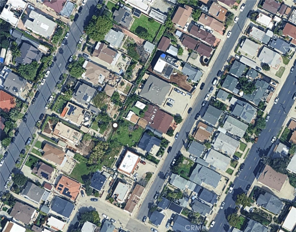 The land parcel is sandwiched between two other parcels.