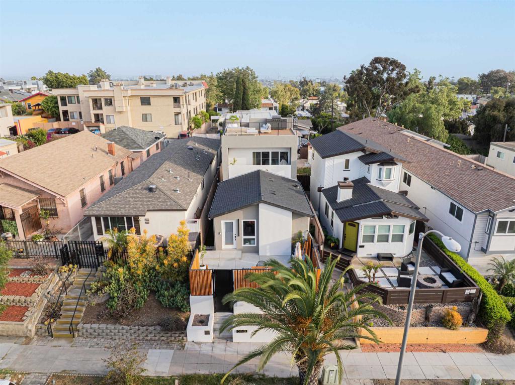 Welcome to an exceptional opportunity in the heart of Golden Hill, where modern design meets urban convenience! A brand-new multi-unit property that offers versatility, style, and income potential that is perfect for savvy investors or homeowners looking to live in luxury while generating passive income. The front unit is a spacious 3-bedroom, 2-bathroom home featuring its own private entrance and a spectacular rooftop deck with breathtaking panoramic views of downtown San Diego make it the perfect spot to unwind or entertain under the city lights. Behind the main residence, you’ll find three separate 1-bedroom, 1-bathroom units, each designed with care and quality finishes to attract excellent tenants and ensure maximum comfort and appeal. Located in one of San Diego’s most desirable neighborhoods, you’ll enjoy walkable access to local restaurants, parks, and downtown San Diego. Whether you’re expanding your real estate portfolio or dreaming of a versatile property with rental income, this gem in Golden Hill checks every box.