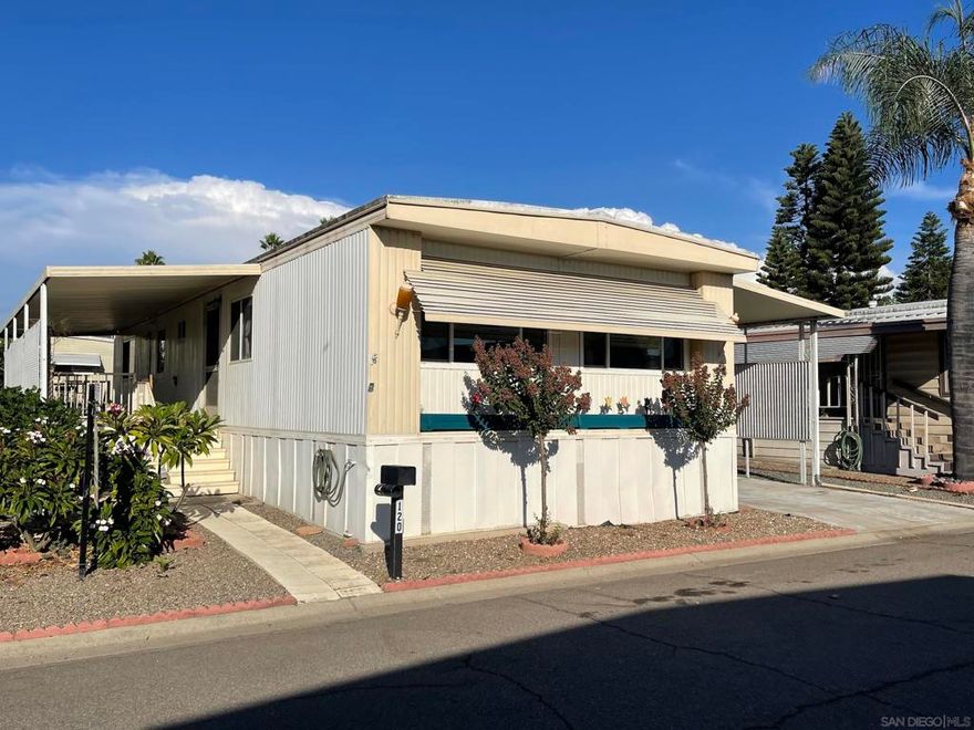 Welcome to Imperial  Escondido Mobile home senior park with 2 recreational pool areas and clubhouse facilities. Our home is convenently located between the two areas for easy access to both. Built in 1970, this doublewide Hillcrest Hallmark model offers a spacious living room and 2 bedrooms with each having their own on-suite bathroom. Their is a covered front porch along with a covered 2 car carport that has a wheelchair access ramp. Their are also 2 storage sheds that convey with the sale. There is room on the side and back for your own outdoor seating area next to a pair of Citrus trees.