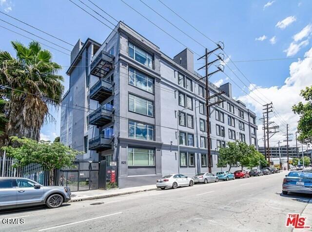 Originally built in 1923 and re-envisioned in 2012. This live/work artists loft in the Arts Districts' Beacon Lofts building has two enclosed bedrooms and two full baths. Many original industrial architectural elements, including polished concrete floors, large windows, high ceilings, huge cement columns, blend seamlessly with modern features like powered blackout shades, double-pane windows, sleek kitchen w/ quartz countertops, stainless steel refrigerator, dishwasher, oven, in-unit washer/dryer, and a private balcony with an unobstructed view of the spectacular DTLA skyline. Rent includes two dedicated spots in tandem in a gated parking area. *WALKTHROUGH VIDEO AVAILABLE*The building's rooftop sky deck includes a hot tub, BBQ and a stunning view of the DTLA skyline. Revel as you live in the culturally immersive Arts District which is home to thriving eateries, breweries, galleries, boutiques, and a bustling social atmosphere. Adjacent to Little Tokyo and more world-class dining and shopping. Free EV station is conveniently located across the street.Walking distance to Warner Music, Urth Cafe, Bestia, Arts District Brewery and more.