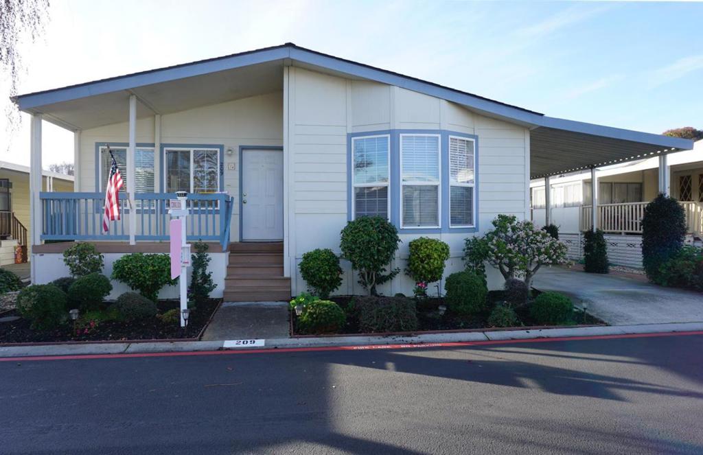 Welcome to this spacious home nestled in a vibrant 55+ park! This beautiful home boasts an abundance of natural light streaming in from the many dual-pane windows. Lush laminate flooring enhances the living and dining rooms, while carpeting softens the bedrooms. The eat-in kitchen is ideal for those who love to cook. It features a portable center island, a breakfast nook, and plenty of cabinet and counter space; all appliances are included. The main suite offers a huge walk-in closet and connects to a private bath with a garden tub, dual sinks, and a step-in shower. The second bedroom is perfect for guests or a home office. Central heating and A/C, along with several ceiling fans, help save energy. The laundry room has a sink, washer/dryer, and multiple storage cabinets. Enjoy peace and relaxation on your front porch, ideal for morning coffee or an afternoon beverage. Stay active in this friendly Senior Community with access to great amenities, including a clubhouse, pool, spa, and regular social activities to stay connected. This community is conveniently located near Highways 101, 237, and 85, public transit options (VTA, CALTRAIN, AMTRAK), shopping, restaurants, hair salons, Grocery Outlet, Seven Seas neighborhood park, and Levi Stadium. 1999 Silvercrest S/N 17306986A/B.