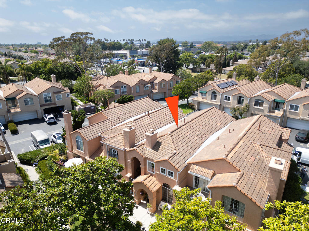 Welcome to the Beautiful Gated Community at the much-desired California Lighthouse. One of the finest complexes on the Oxnard Plain. This turn-key nicely upgraded two Bedroom 2.5 Bath condo boost pride in ownership. As you walk into freshly painted, High vaulted ceilings, Laminate wood like floors throughout the lower level are as beautiful but better than wood. Wonderful natural light splashes through the energy efficient double-pane windows. Venture into the family room with fireplace, Then into the open kitchen with porcelain granite like countertops, wood finished cabinets, stainless sink, with adjacent pantry and indoor enclosed laundry. Recently installed carpet on stairs and upper level, a glass slider opens to your private outdoor covered balcony. Stairs then lead up to the second-floor bonus room/Den/Office. Bathrooms have all been tastefully upgraded. The master bath is beautifully updated with large, tiled floors, custom countertops and sinks, step in separate shower and separate king size porcelain soaking tub. Large two car, attached garage with direct access to the kitchen. This complex feels and looks like a resort. The grounds are parklike with swimming pools, hot tubs, and walking areas. Close to the local beaches, harbors, restaurants, and shopping.