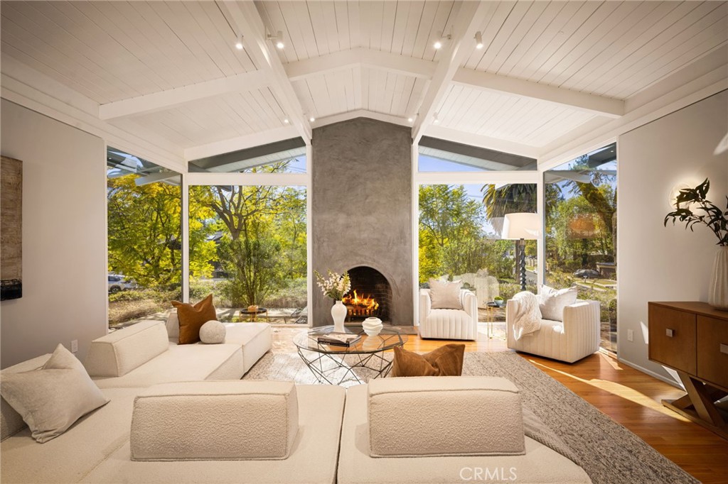 Welcome to 4750 Poe Avenue, a stunning mid-century modern masterpiece nestled in the prestigious Vista de Oro neighborhood of Woodland Hills. Designed by the acclaimed architect Louis M. Naidorf, celebrated for his work on Hollywood's iconic Capitol Records Building, this home was thoughtfully crafted as his personal residence. This architectural gem offers four bedrooms, four fully remodeled bathrooms, an office, and a den within its expansive 3,287 square feet. The home boasts exquisite custom white oak cabinetry and premium finishes that complement its modern aesthetic. Refinished floors throughout the residence add to its warm and inviting ambiance. The exterior is equally impressive, featuring a newly refinished pool with brand-new concrete surroundings, fresh landscaping, and a seamless indoor-outdoor flow. The smooth stucco finish enhances its timeless mid-century appeal.
Experience the visionary design and enduring elegance of this mid-century modern icon.